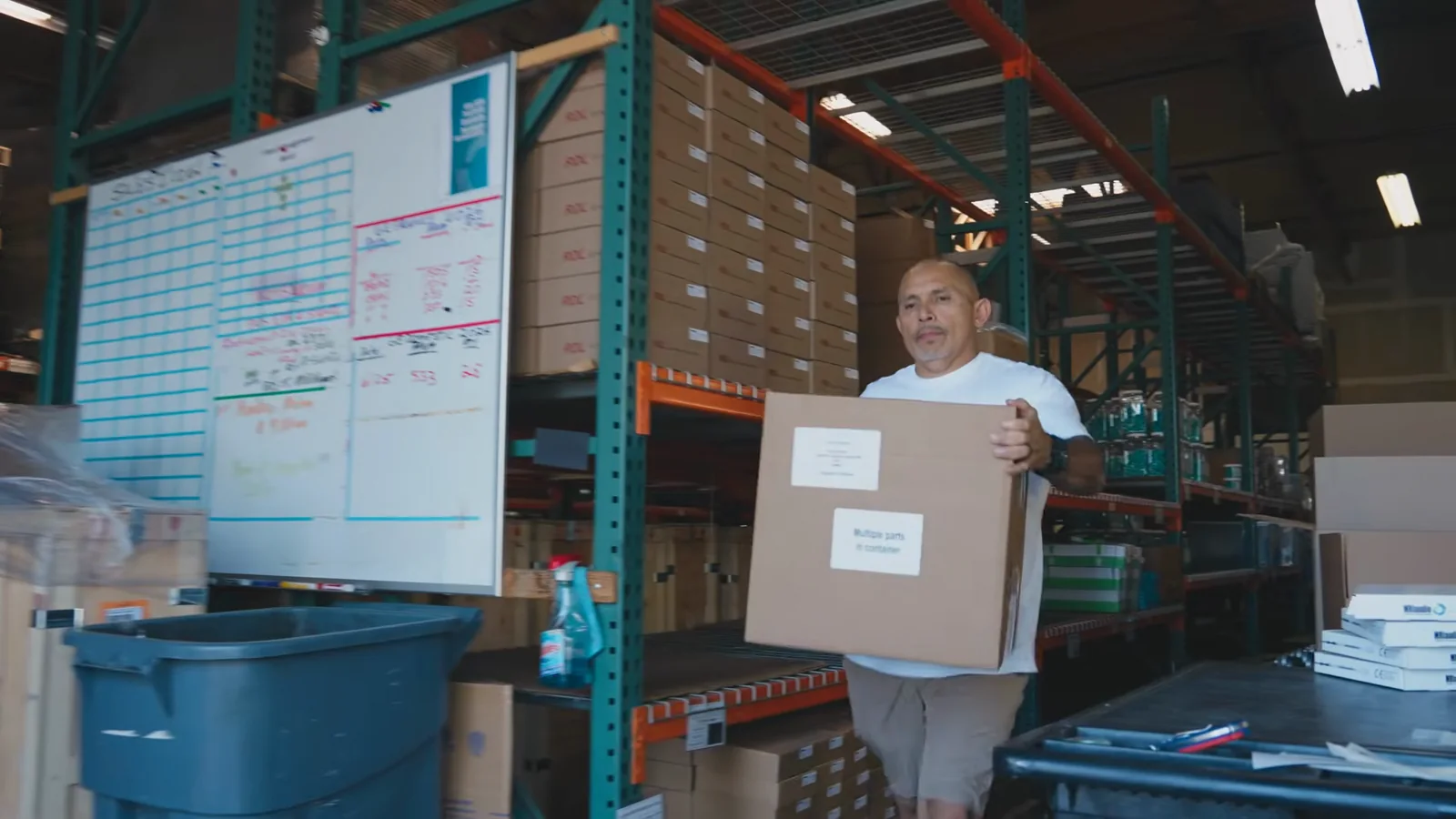 Arnie carrying an order through the warehouse