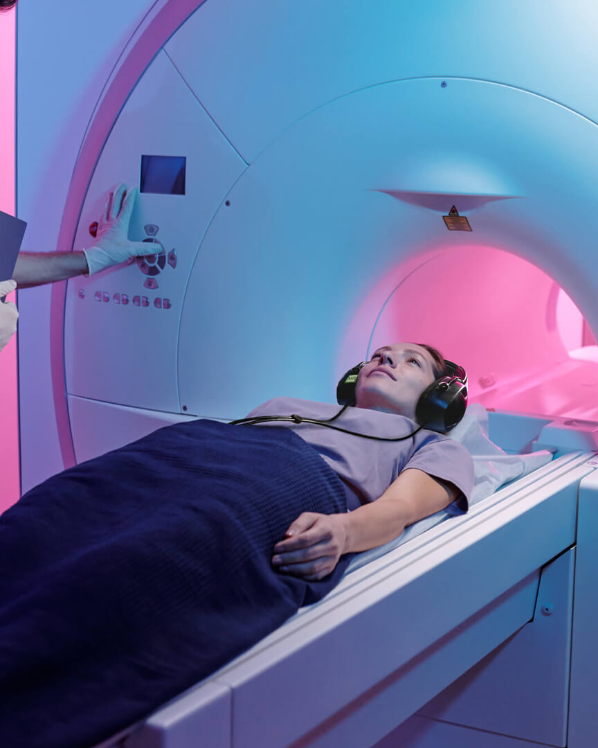 woman wearing MRI headphones during scan