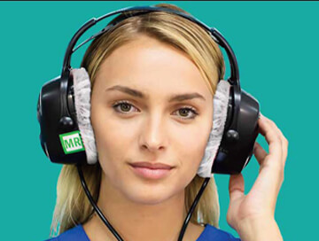 Woman wearing MRI compatible headphones