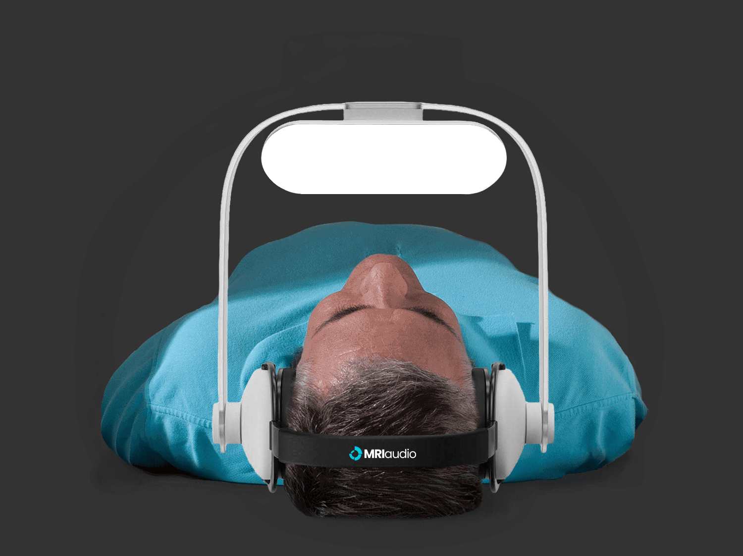 Man watching movies during MRI scan with MRIaudio equipment.