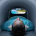 Man watching movie while inside an MRI machine